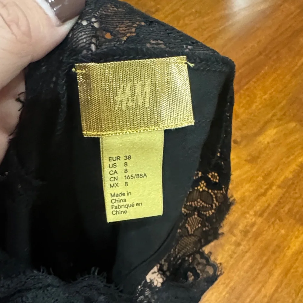 H&M Sexy Black Lace Trim Bodysuit size 8 fits like an M